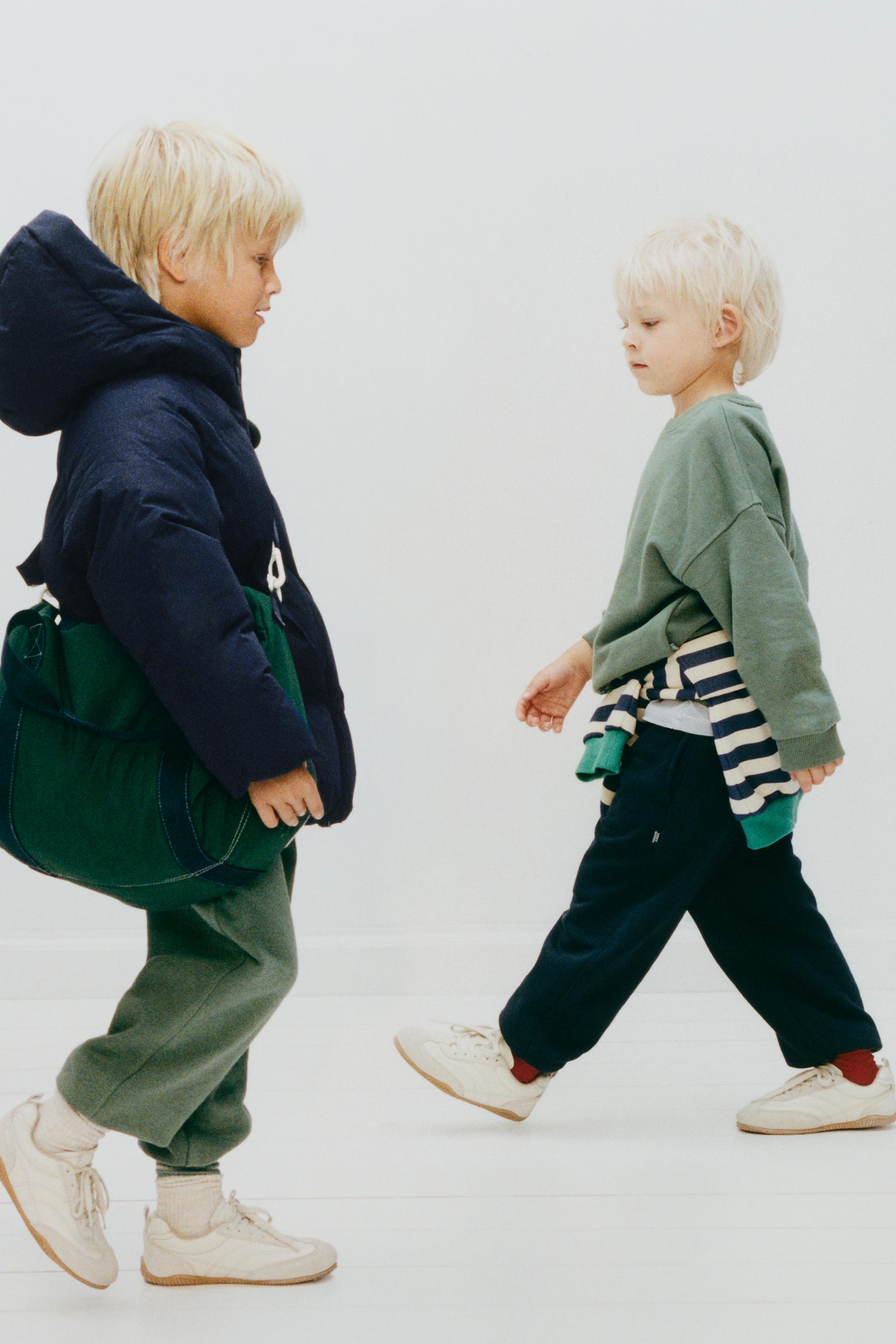 MANTEAU MATELASSÉ À CAPUCHE DÉPERLANT